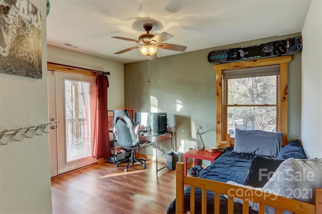 263 Summer Circle Clyde, NC 28721 - Photo 22 of 36 a living room with furniture and wooden floor