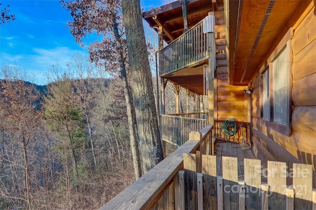 263 Summer Circle Clyde, NC 28721 - Photo 27 of 36 a view of balcony with wooden floor and fence