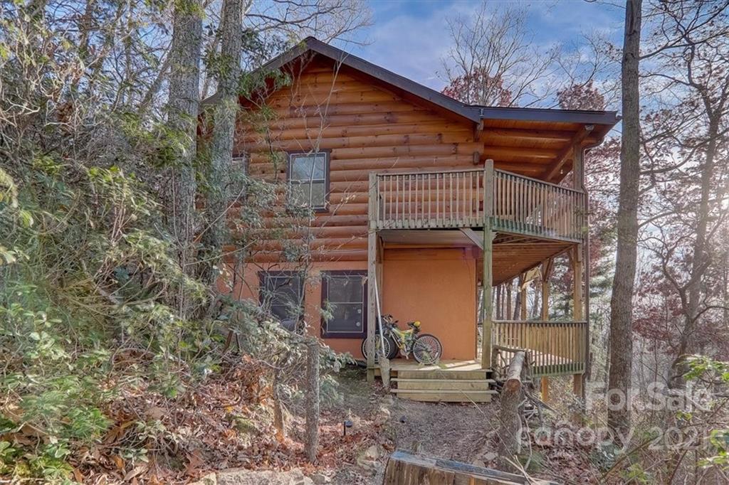 263 Summer Circle Clyde, NC 28721 - Photo 5 of 36 a front view of a house with garden