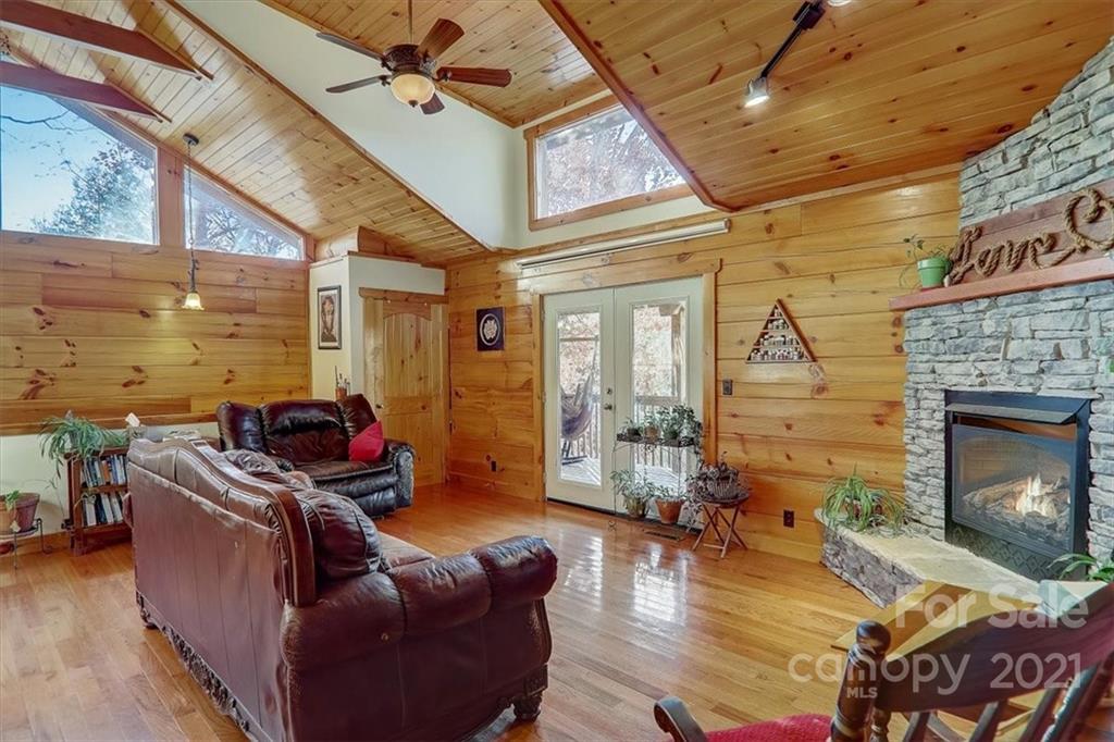 263 Summer Circle Clyde, NC 28721 - Photo 6 of 36 a living room with furniture and a fireplace