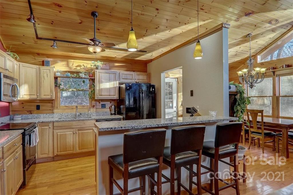 263 Summer Circle Clyde, NC 28721 - Photo 9 of 36 a kitchen with a sink and cabinets
