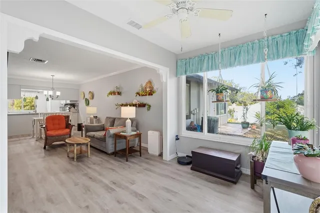 a room with lots of furniture and a large window