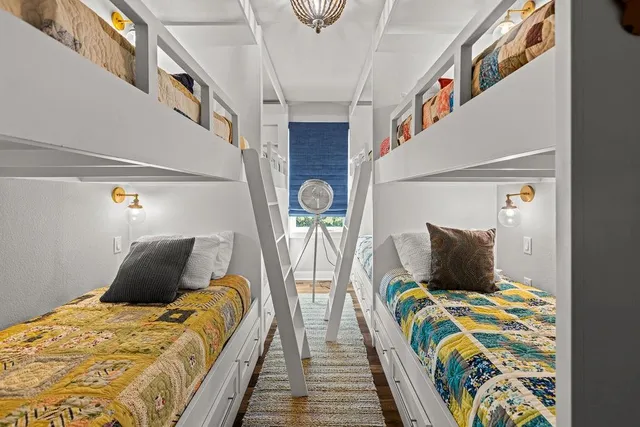 a large kitchen with lots of counter space a sink appliances and cabinets