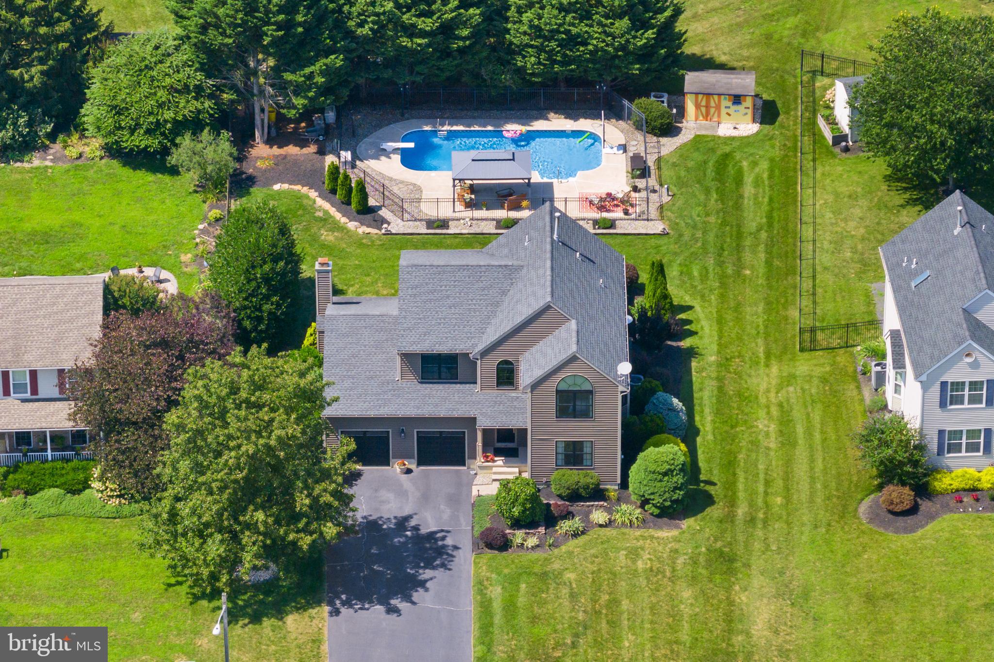 an aerial view of a house with a garden