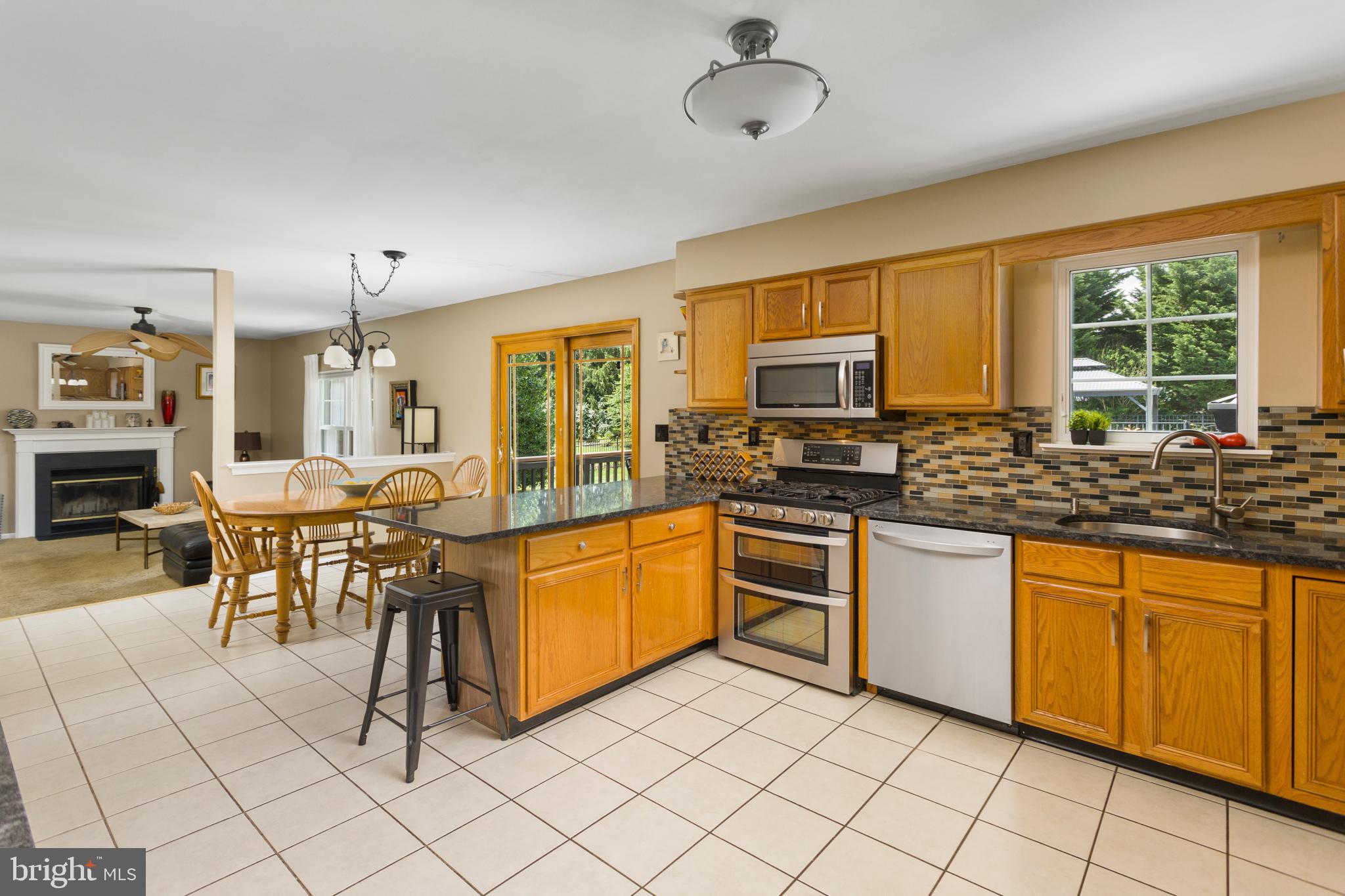 34 Valley Forge Road Bordentown, NJ 08505 - Photo 14 of 56 a kitchen with granite countertop a sink cabinets and stainless steel appliances