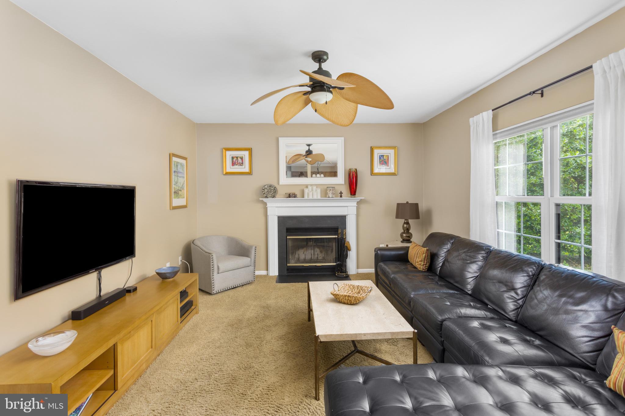 34 Valley Forge Road Bordentown, NJ 08505 - Photo 19 of 56 a living room with furniture a flat screen tv and a fireplace