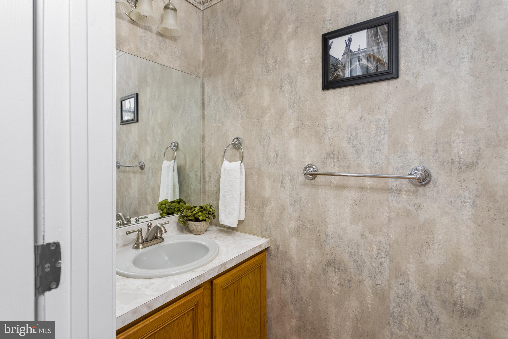 34 Valley Forge Road Bordentown, NJ 08505 - Photo 21 of 56 a bathroom with a sink and a mirror