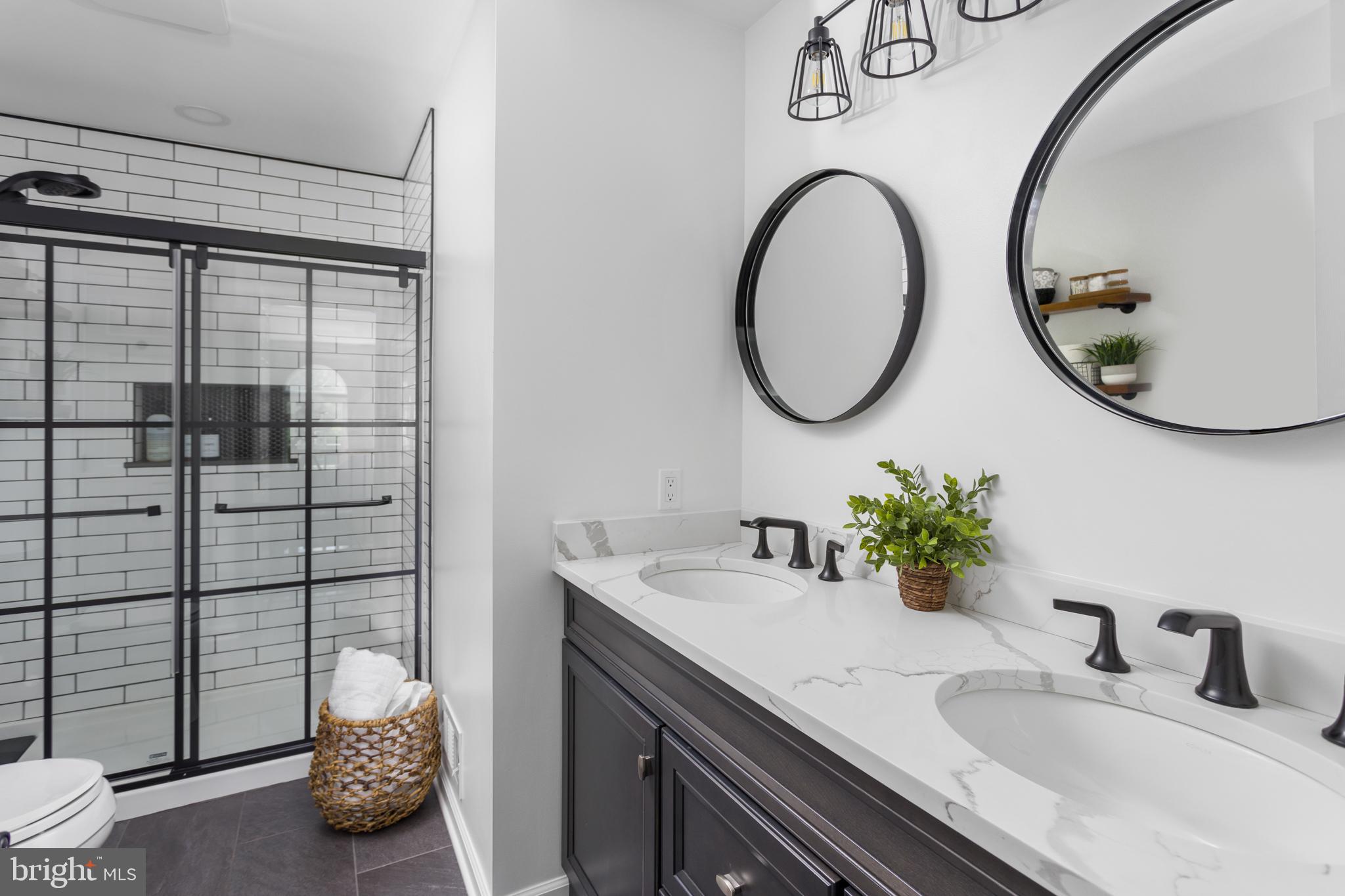 34 Valley Forge Road Bordentown, NJ 08505 - Photo 31 of 56 a bathroom with a granite countertop sink and a mirror