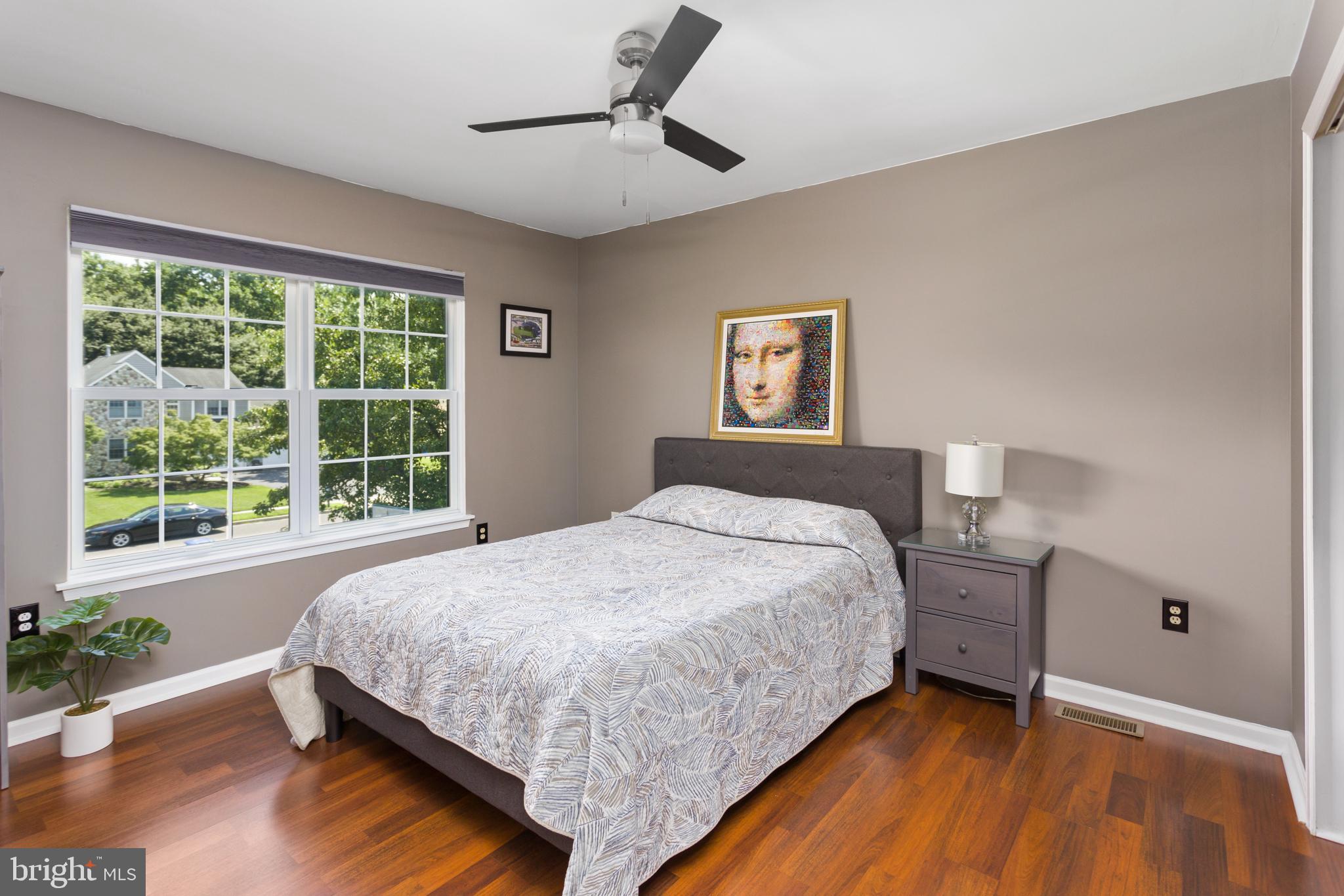 34 Valley Forge Road Bordentown, NJ 08505 - Photo 33 of 56 a bedroom with a bed lamp and a large window
