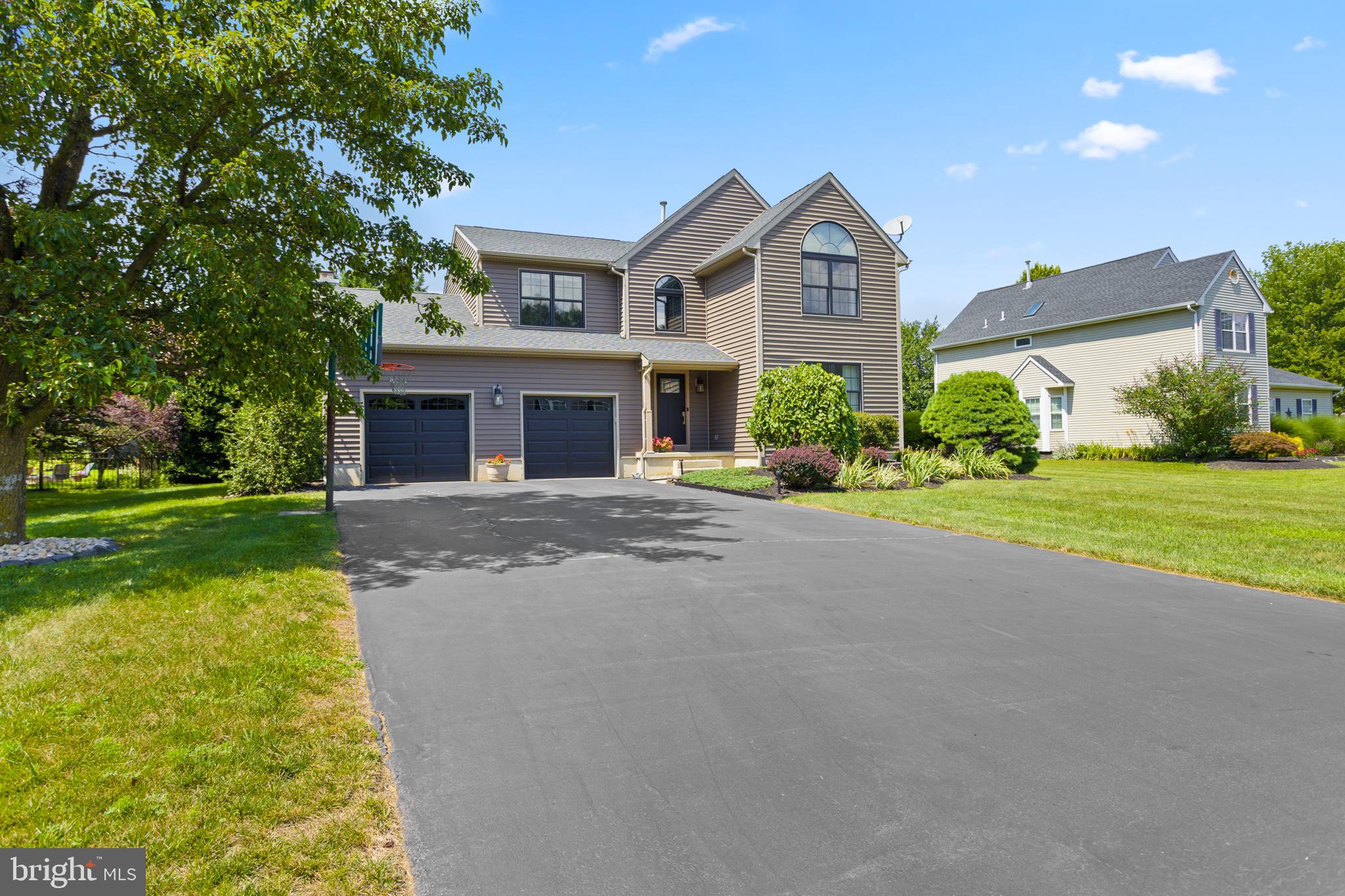 34 Valley Forge Road Bordentown, NJ 08505 - Photo 4 of 56 a front view of a house with a yard and garage