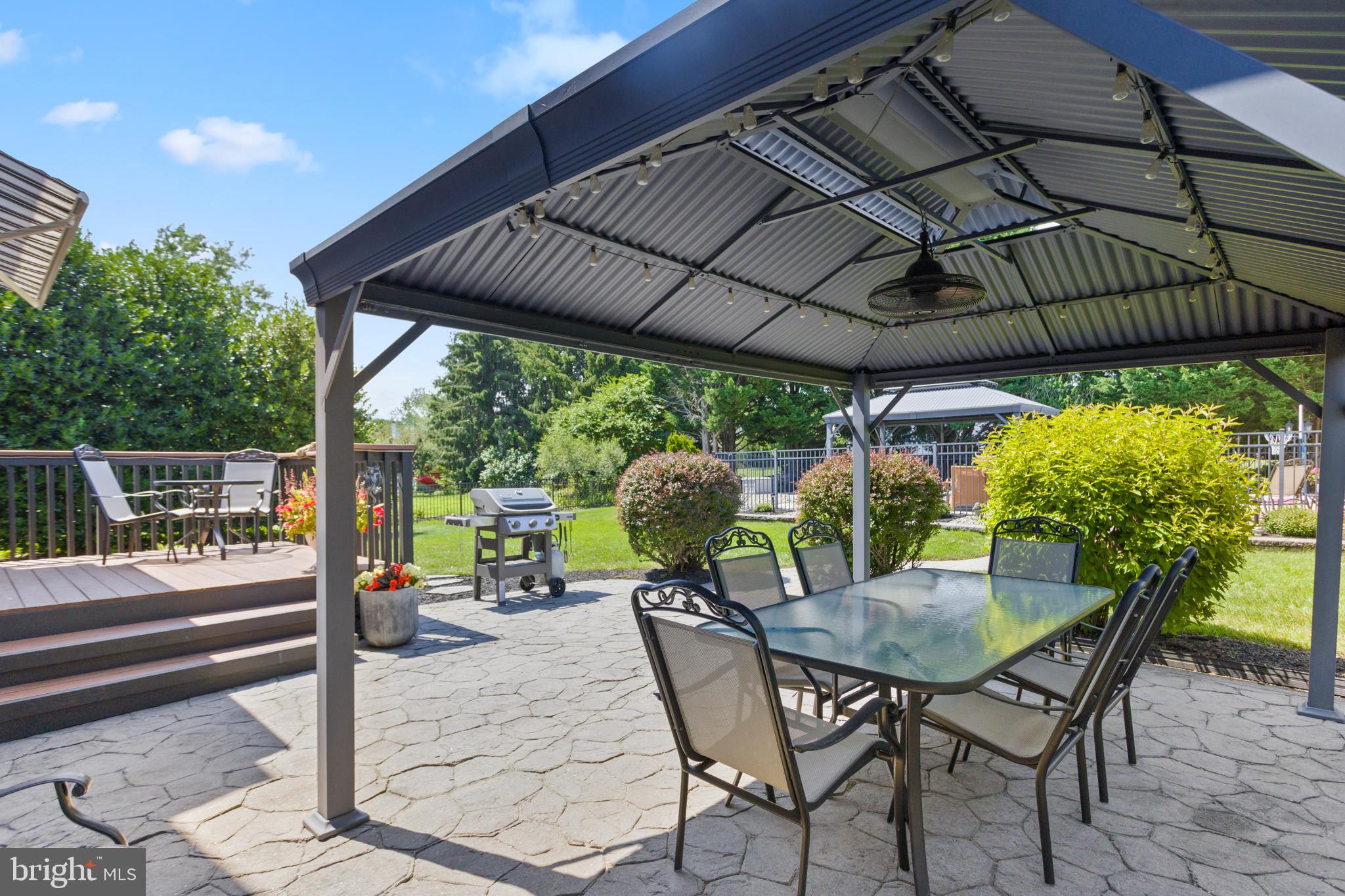 34 Valley Forge Road Bordentown, NJ 08505 - Photo 45 of 56 a patio with a patio table and chairs