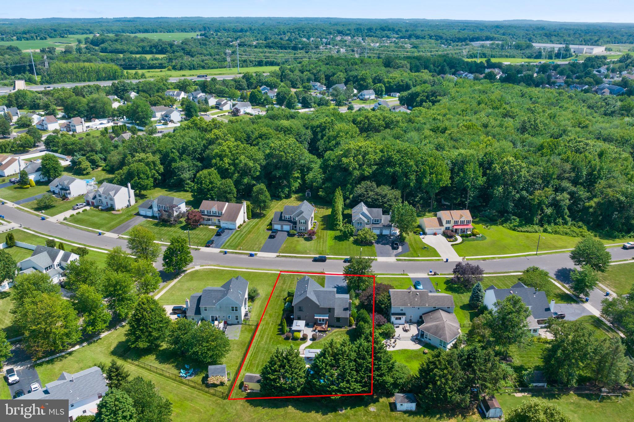 34 Valley Forge Road Bordentown, NJ 08505 - Photo 55 of 56 an aerial view of a house with a garden fire pit and large trees
