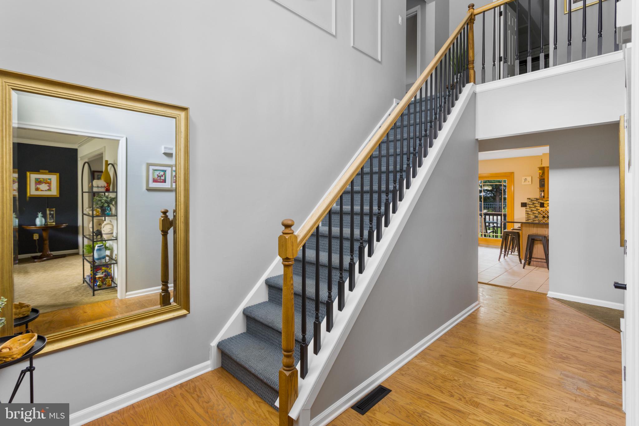 34 Valley Forge Road Bordentown, NJ 08505 - Photo 8 of 56 a view of a livingroom with wooden floor and stairs