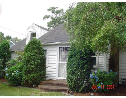 153 Swifts Beach Road Wareham, MA 02571 - Photo 3 of 9 a view of a house with a yard