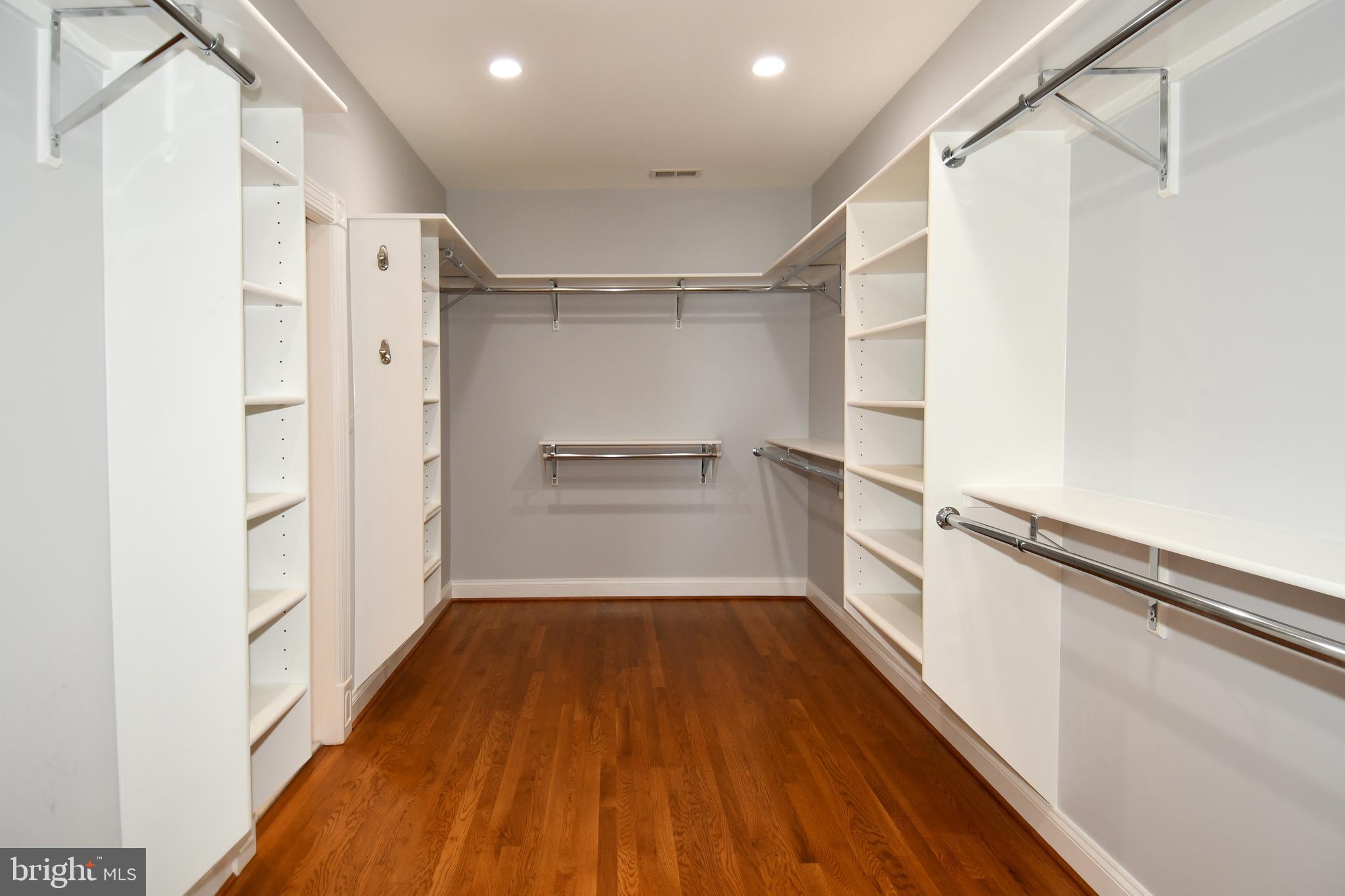 7808 Southdown Road Alexandria, VA 22308 - Photo 71 of 99 a view of a walk in closet with wooden floor