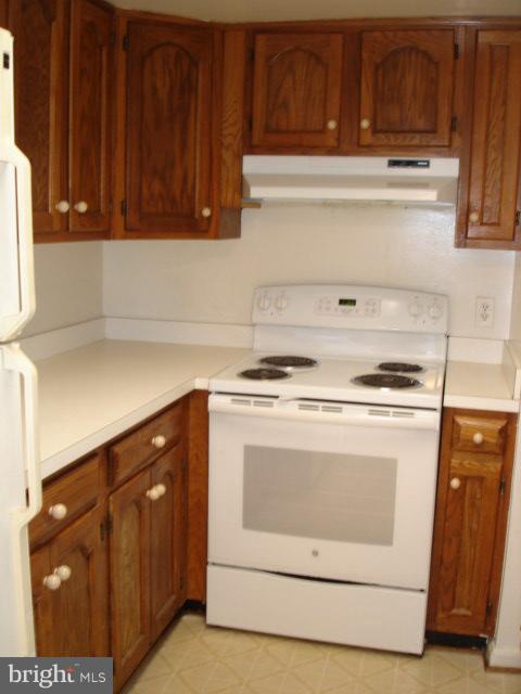 1301 North Courthouse Road, Unit 1109 Arlington, VA 22201 - Photo 12 of 20 a stove top oven sitting inside of a kitchen