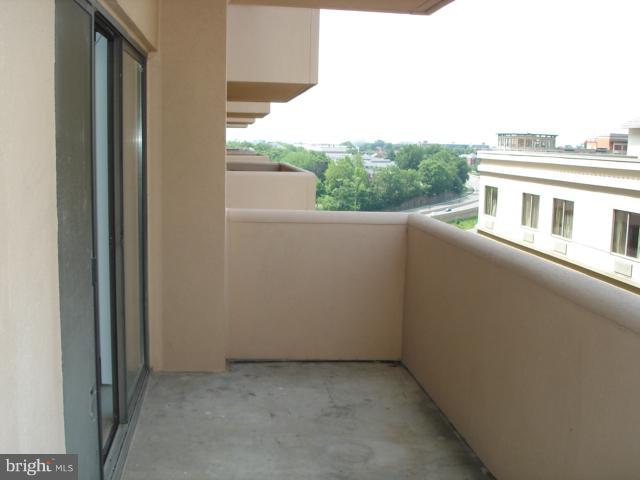 1301 North Courthouse Road, Unit 1109 Arlington, VA 22201 - Photo 5 of 20 a view of balcony with furniture and city view