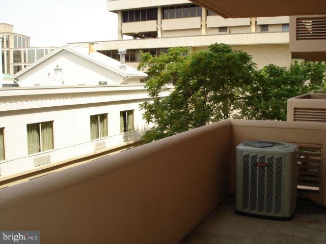1301 North Courthouse Road, Unit 1109 Arlington, VA 22201 - Photo 6 of 20 a view of a house with a street