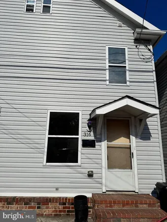 a view of a house with a large window