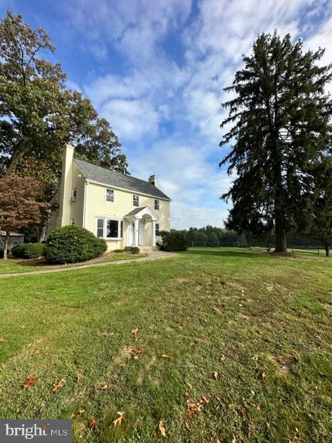 21800 Peach Tree Road Dickerson, MD 20842 - Photo 18 of 18 a white house with a big yard and large trees