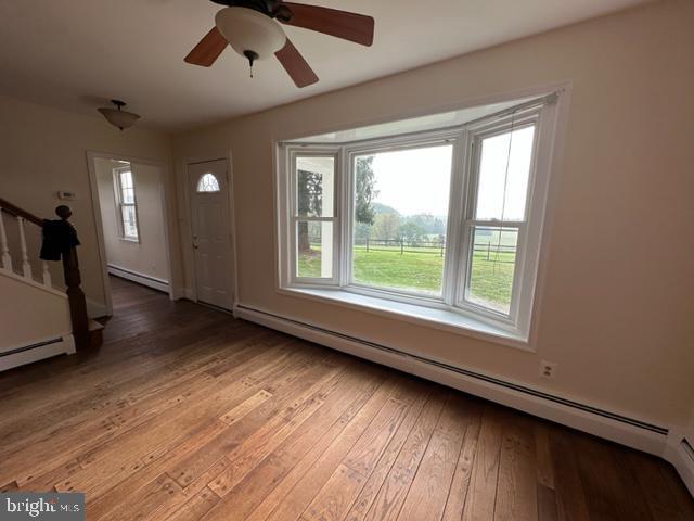 21800 Peach Tree Road Dickerson, MD 20842 - Photo 6 of 18 a view of a livingroom with wooden floor and a large window