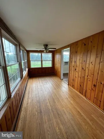 a view of kitchen with furniture and wooden floor