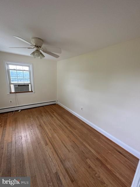 21800 Peach Tree Road Dickerson, MD 20842 - Photo 10 of 18 an empty room with wooden floor and windows
