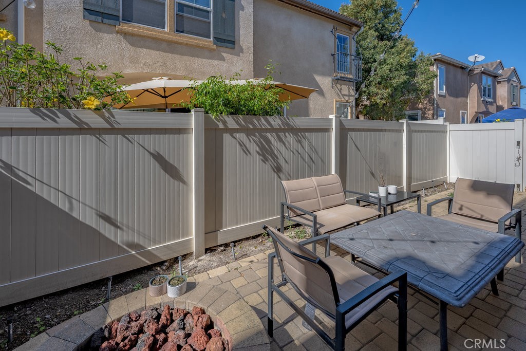 3631 Dunkirk Drive Oxnard, CA 93035 - Photo 11 of 16 a view of backyard with a table and chairs