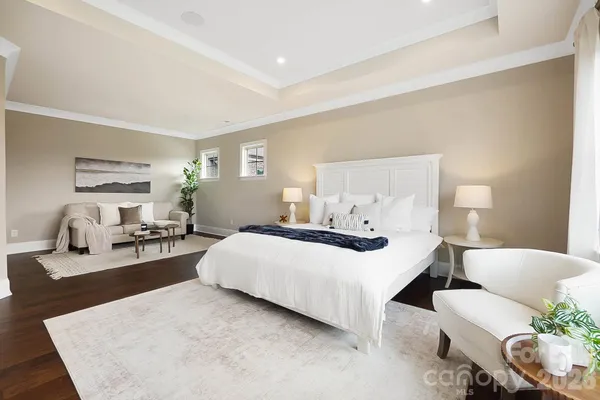 a bedroom with a bed and a couch