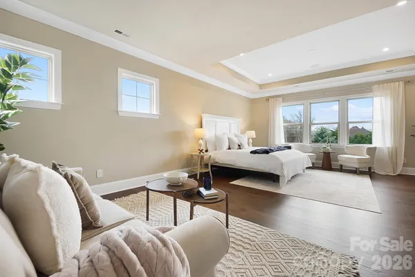 a bedroom with furniture and a window