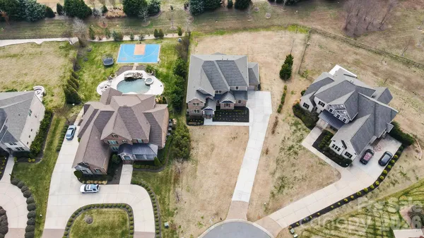 swimming pool view with a garden view
