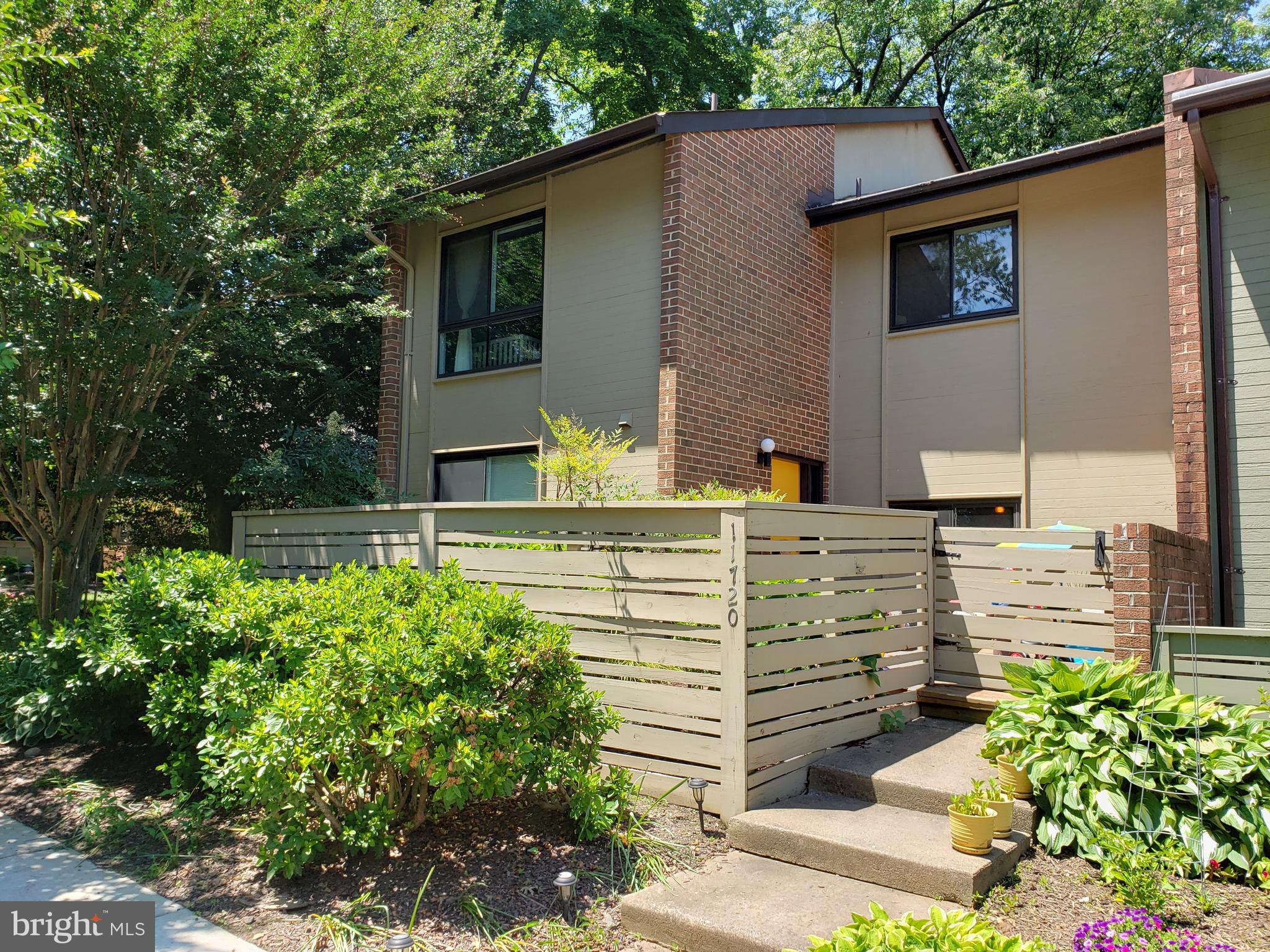 End unit townhouse with front and back decks.