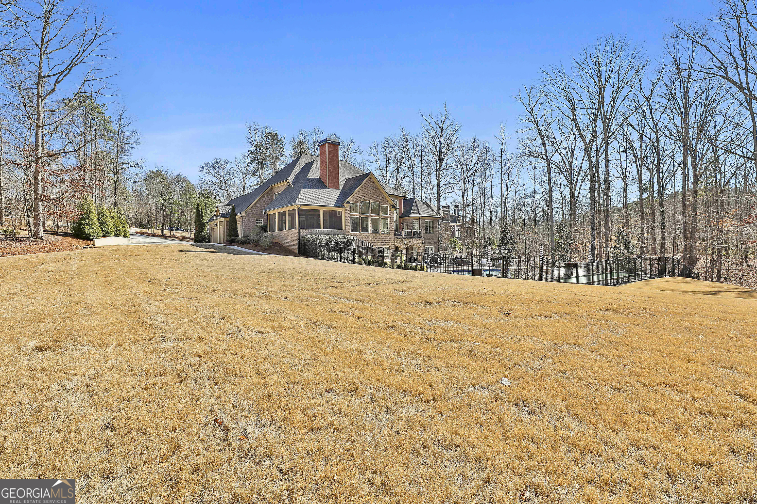 35 Fern Leaf Way Newnan, GA 30265 - Photo 110 of 112 a view of large house with a yard covered with snow