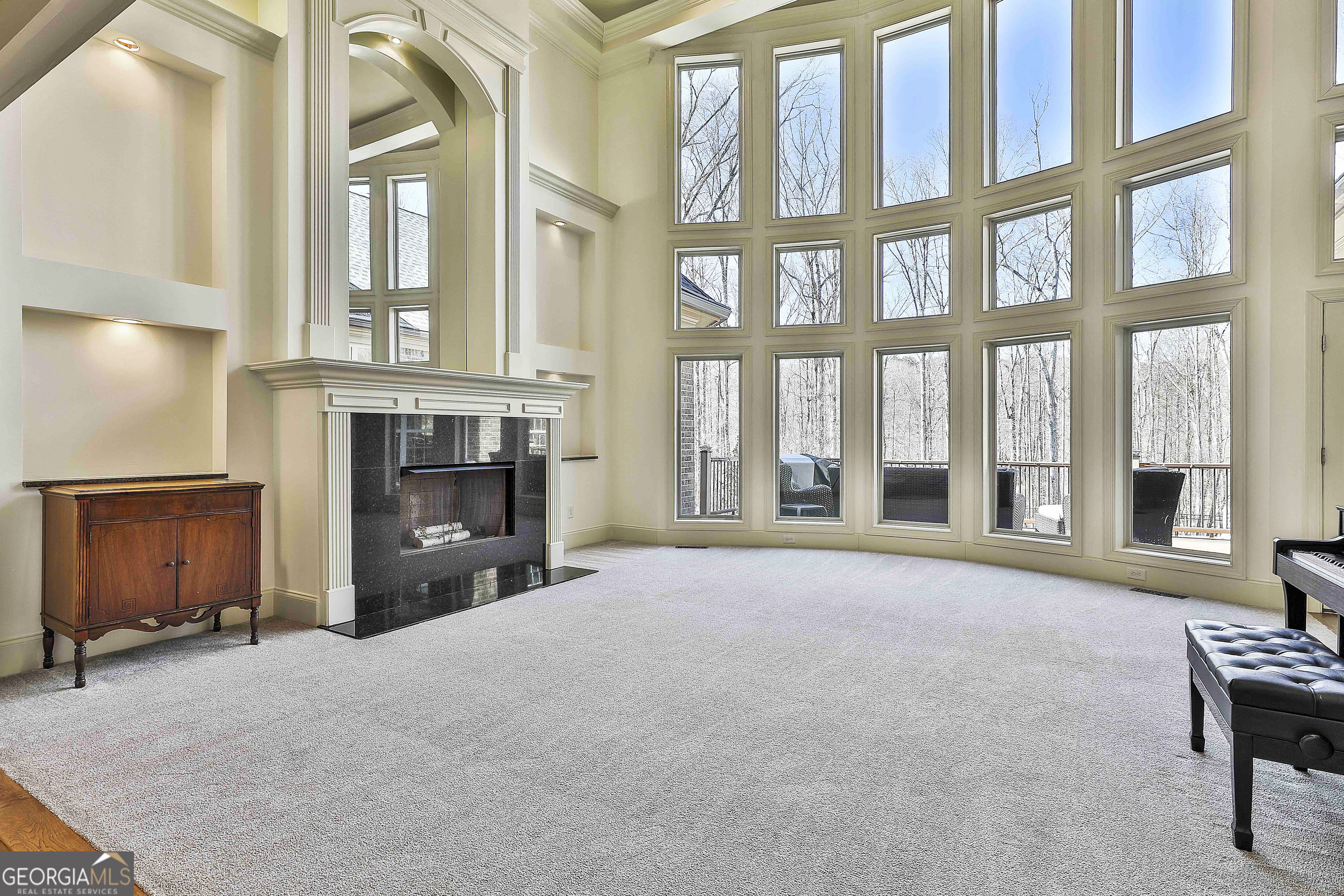 35 Fern Leaf Way Newnan, GA 30265 - Photo 19 of 112 a view of an empty room with a fireplace and windows