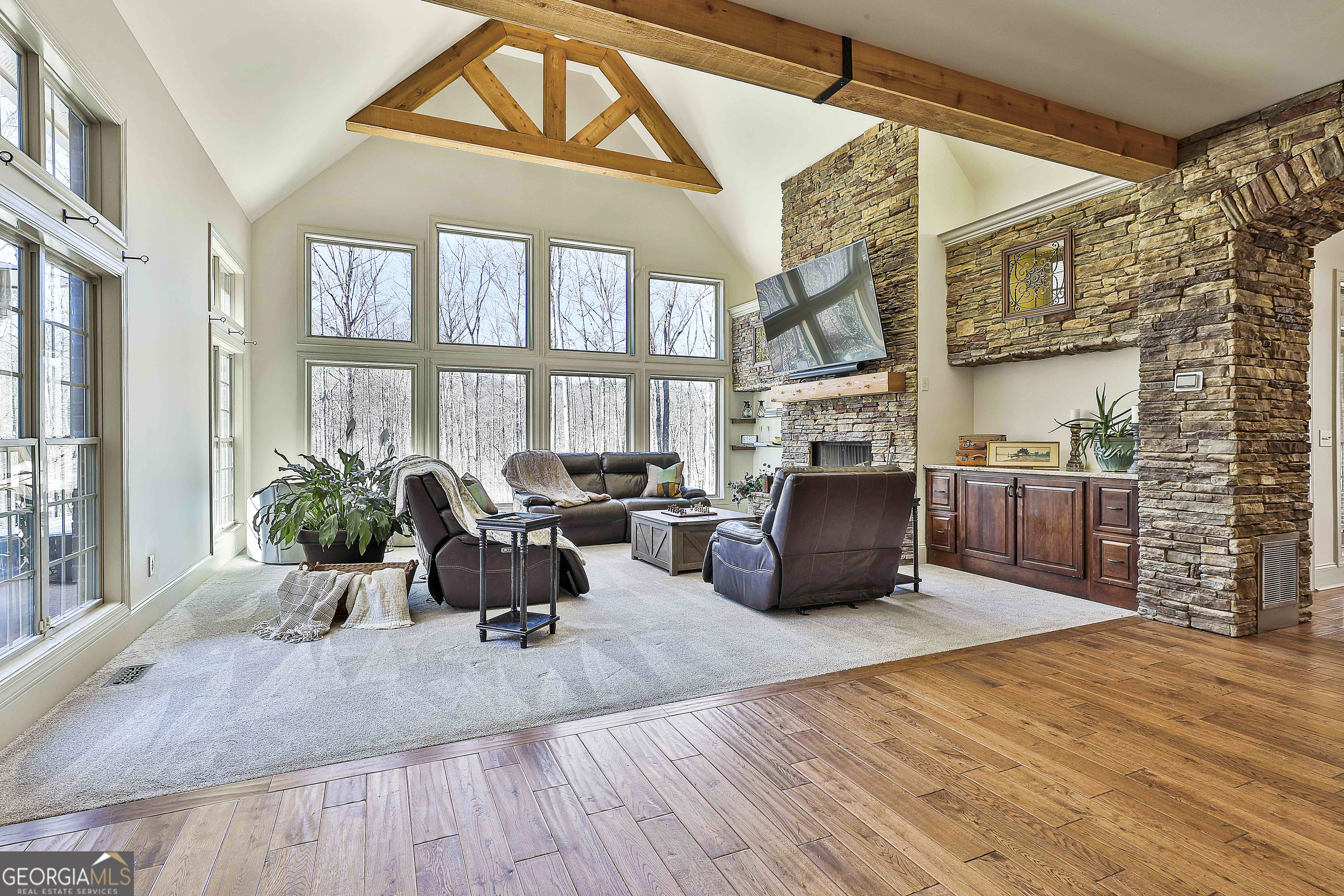 35 Fern Leaf Way Newnan, GA 30265 - Photo 22 of 112 a living room with furniture large windows and wooden floor