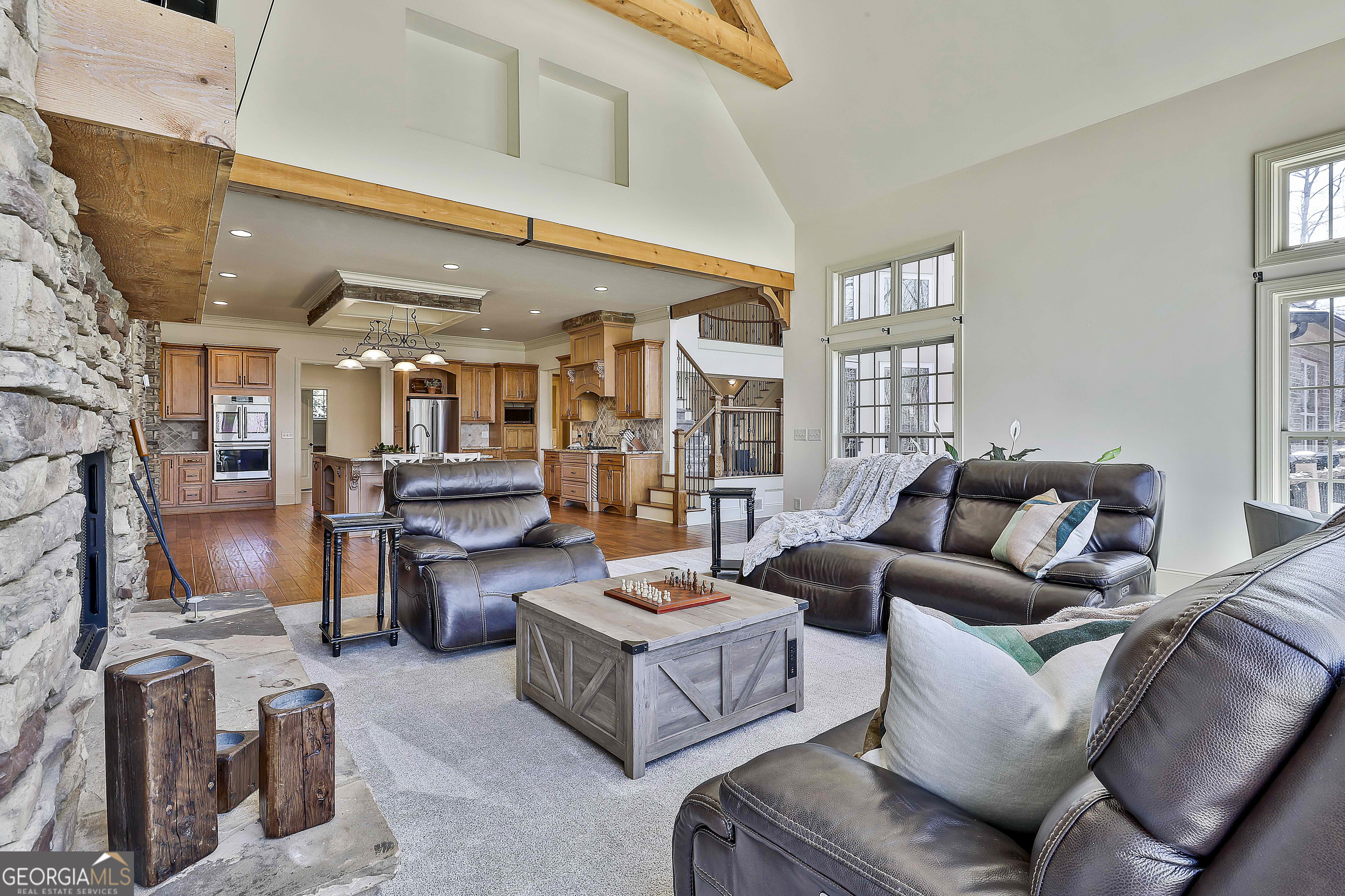 35 Fern Leaf Way Newnan, GA 30265 - Photo 27 of 112 a living room with furniture kitchen view and a fireplace