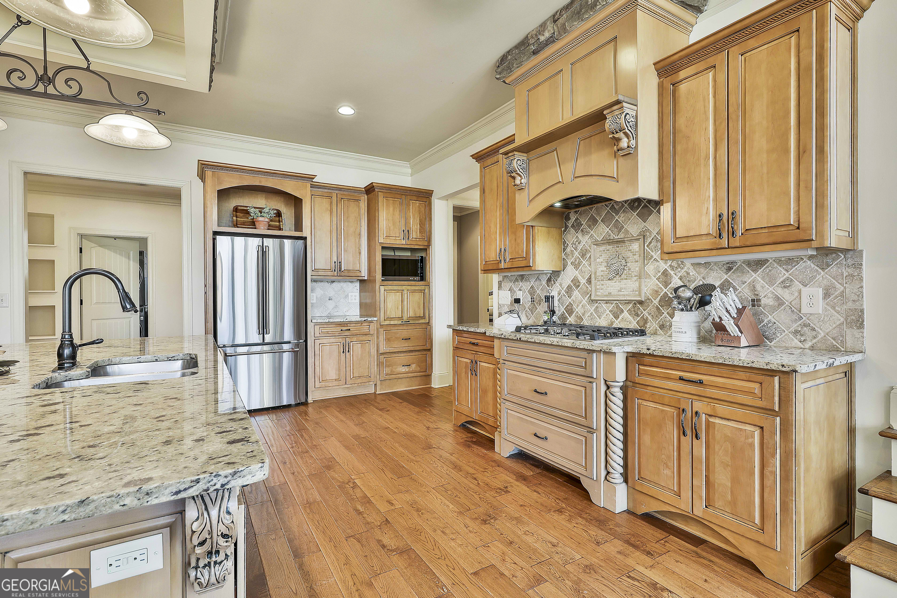 35 Fern Leaf Way Newnan, GA 30265 - Photo 33 of 112 a kitchen with granite countertop a sink stainless steel appliances and cabinets