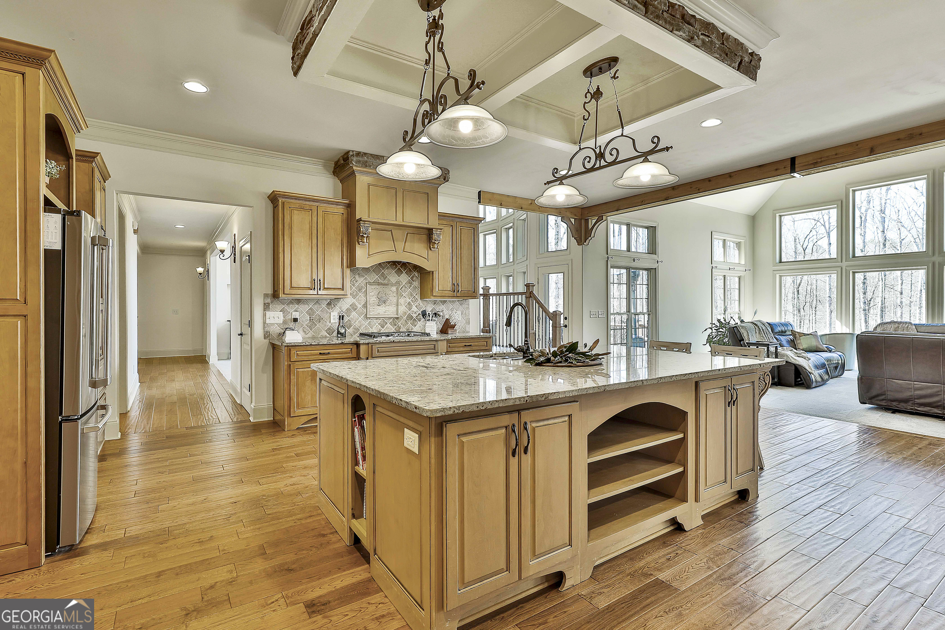 35 Fern Leaf Way Newnan, GA 30265 - Photo 37 of 112 a large kitchen with kitchen island a large island in the center and stainless steel appliances