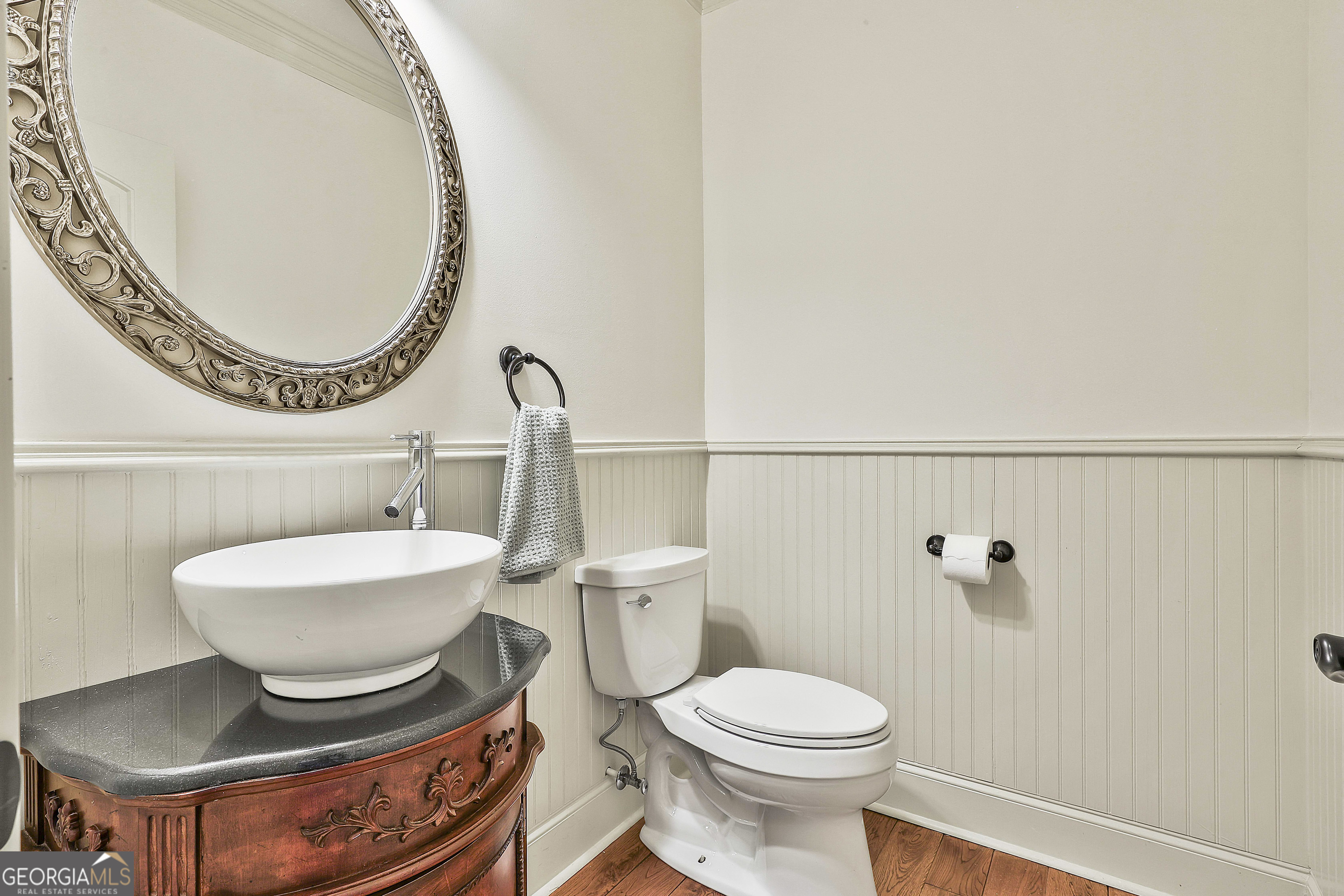 35 Fern Leaf Way Newnan, GA 30265 - Photo 45 of 112 a bathroom with a toilet a sink and a mirror