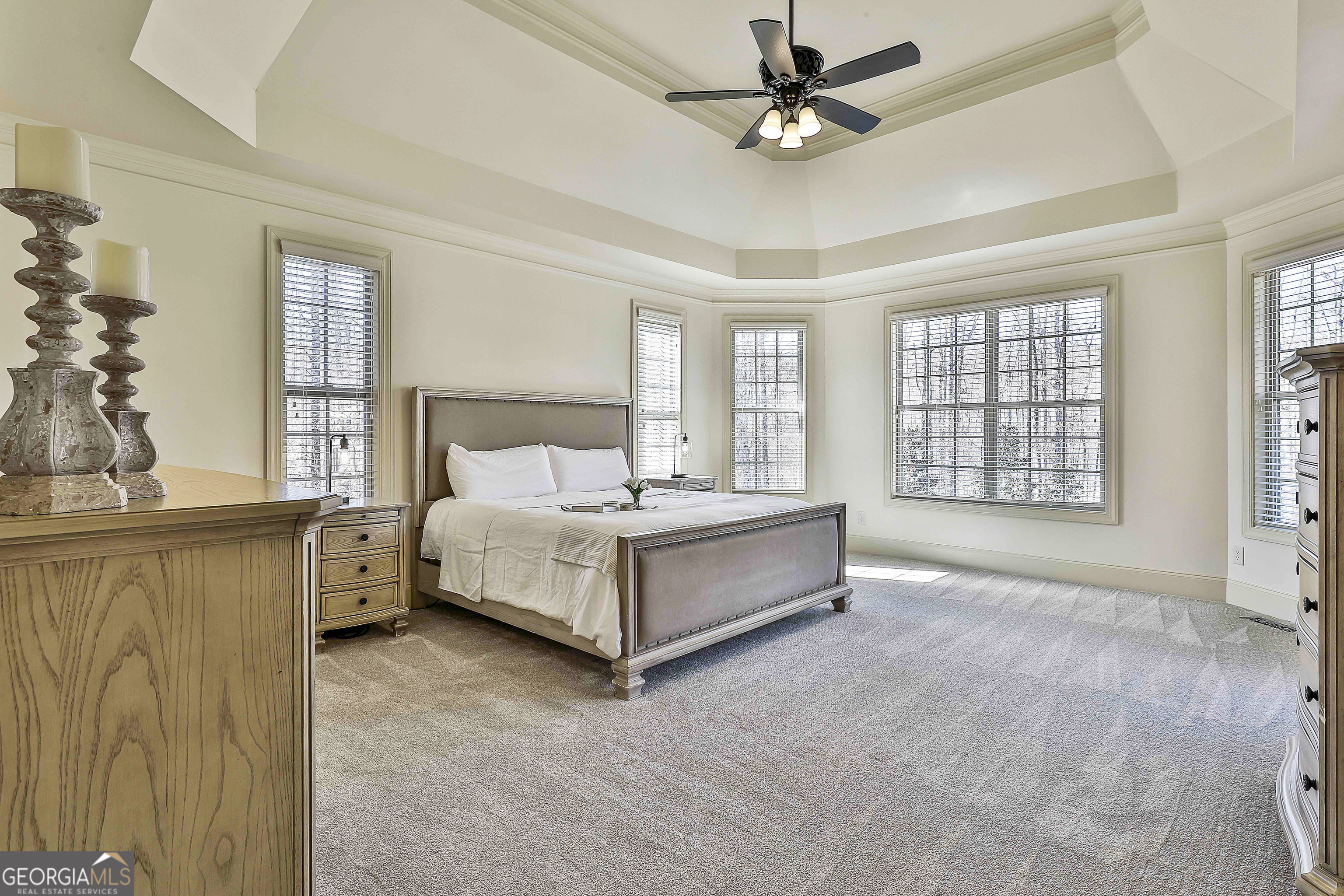 35 Fern Leaf Way Newnan, GA 30265 - Photo 46 of 112 a spacious bedroom with a large bed and a chandelier