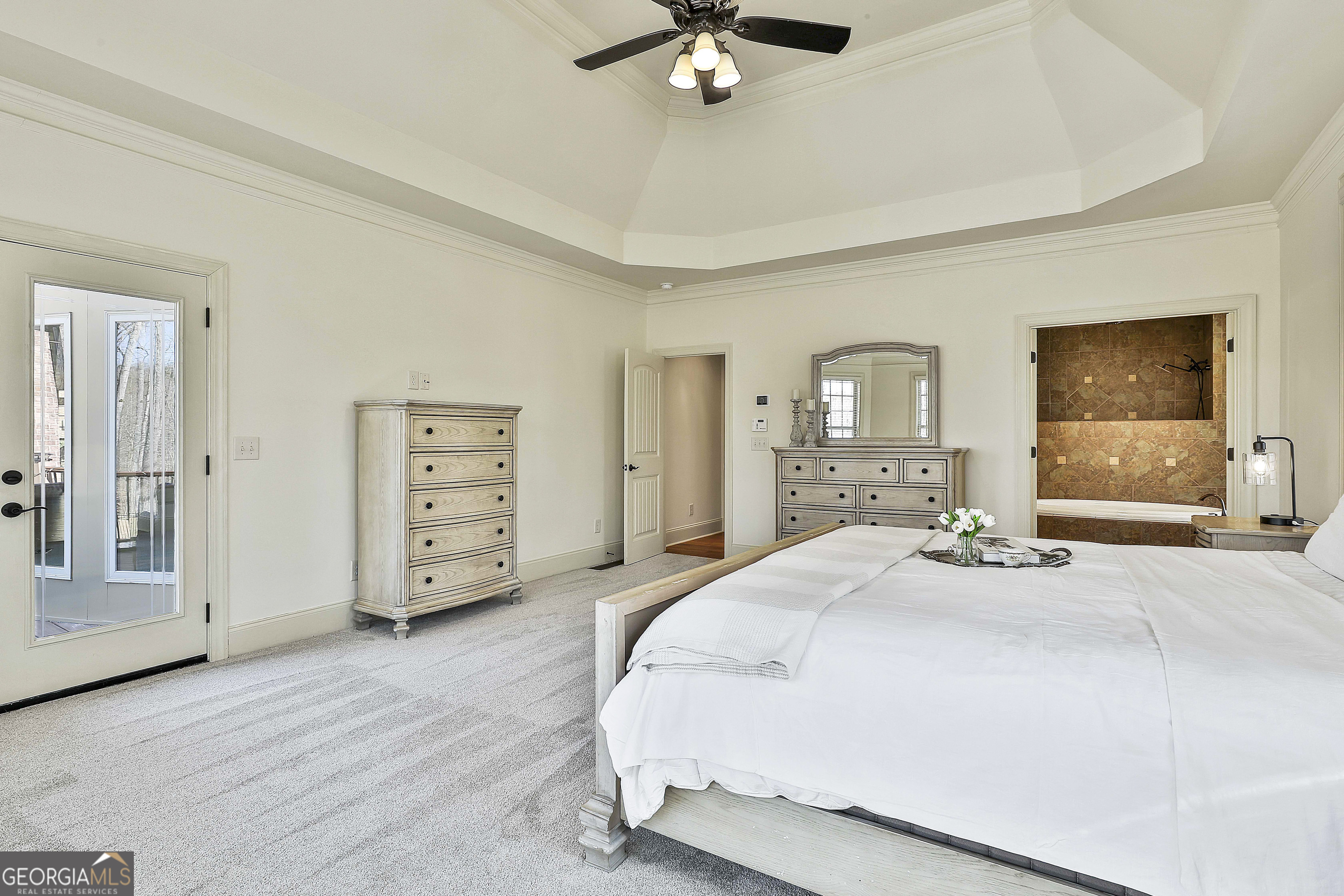 35 Fern Leaf Way Newnan, GA 30265 - Photo 48 of 112 a spacious bedroom with a bed a dresser and dresser