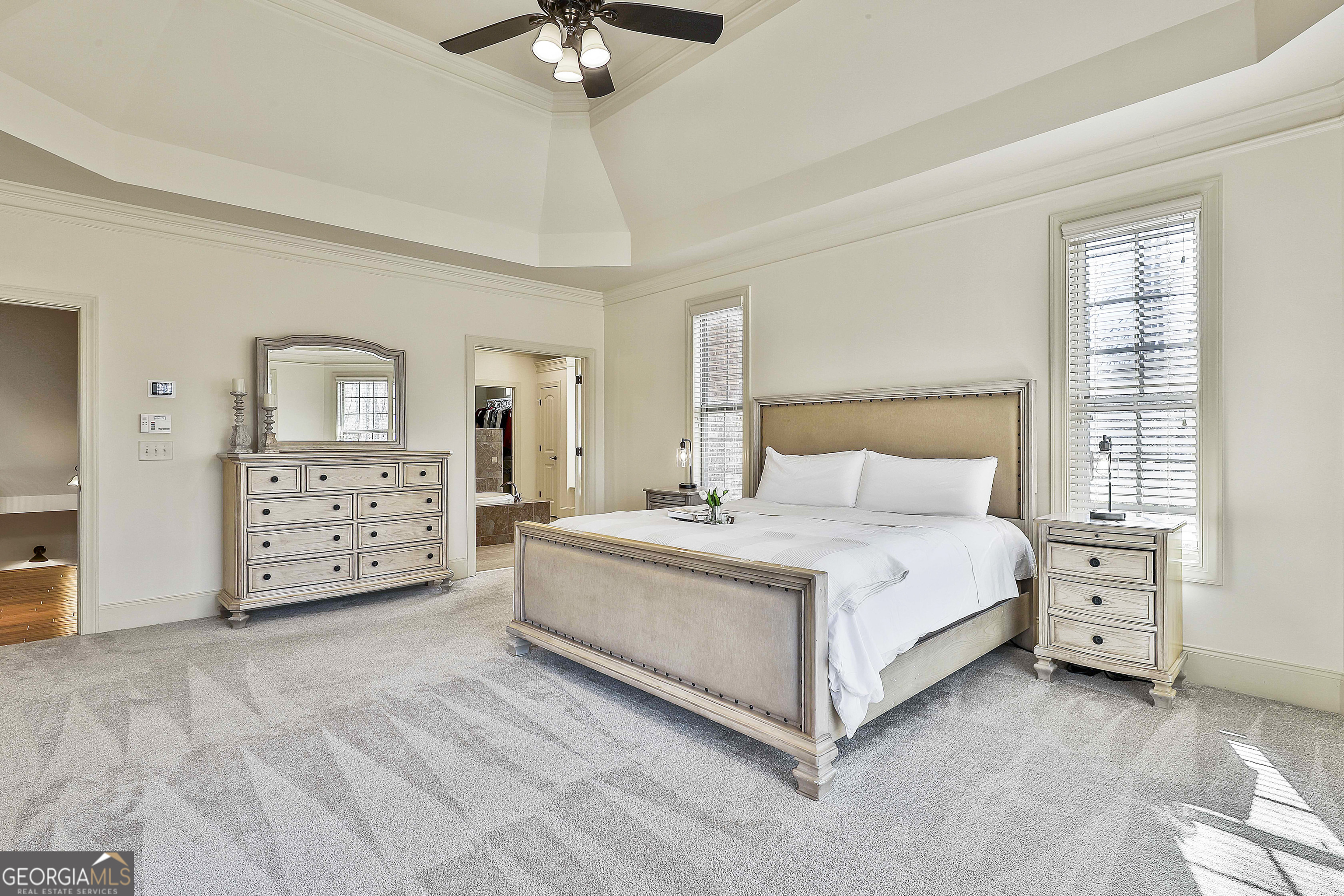35 Fern Leaf Way Newnan, GA 30265 - Photo 51 of 112 a spacious bedroom with a bed a couch and dresser