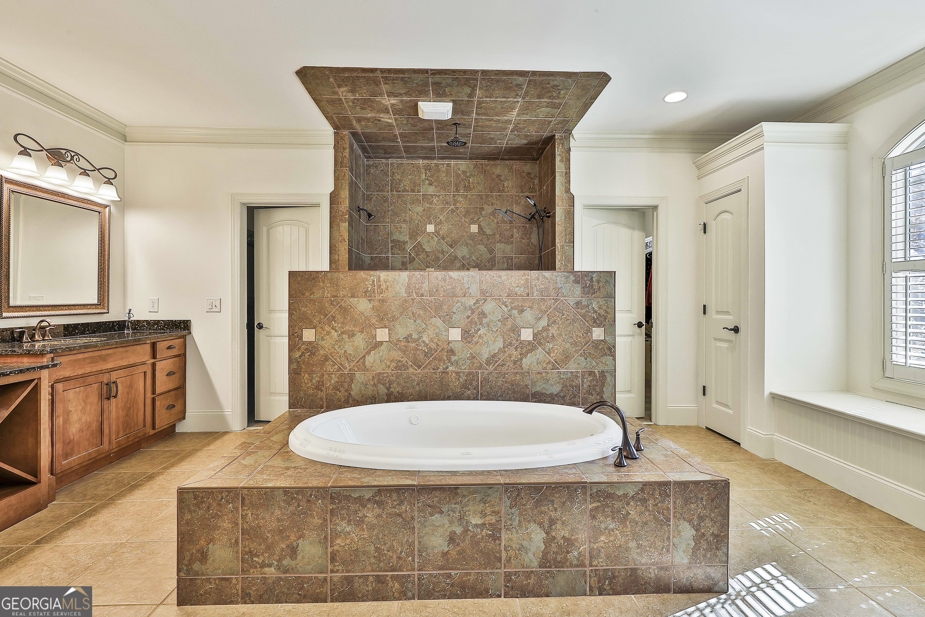 35 Fern Leaf Way Newnan, GA 30265 - Photo 52 of 112 a spacious bathroom with a granite countertop bathtub sink vanity mirror and toilet
