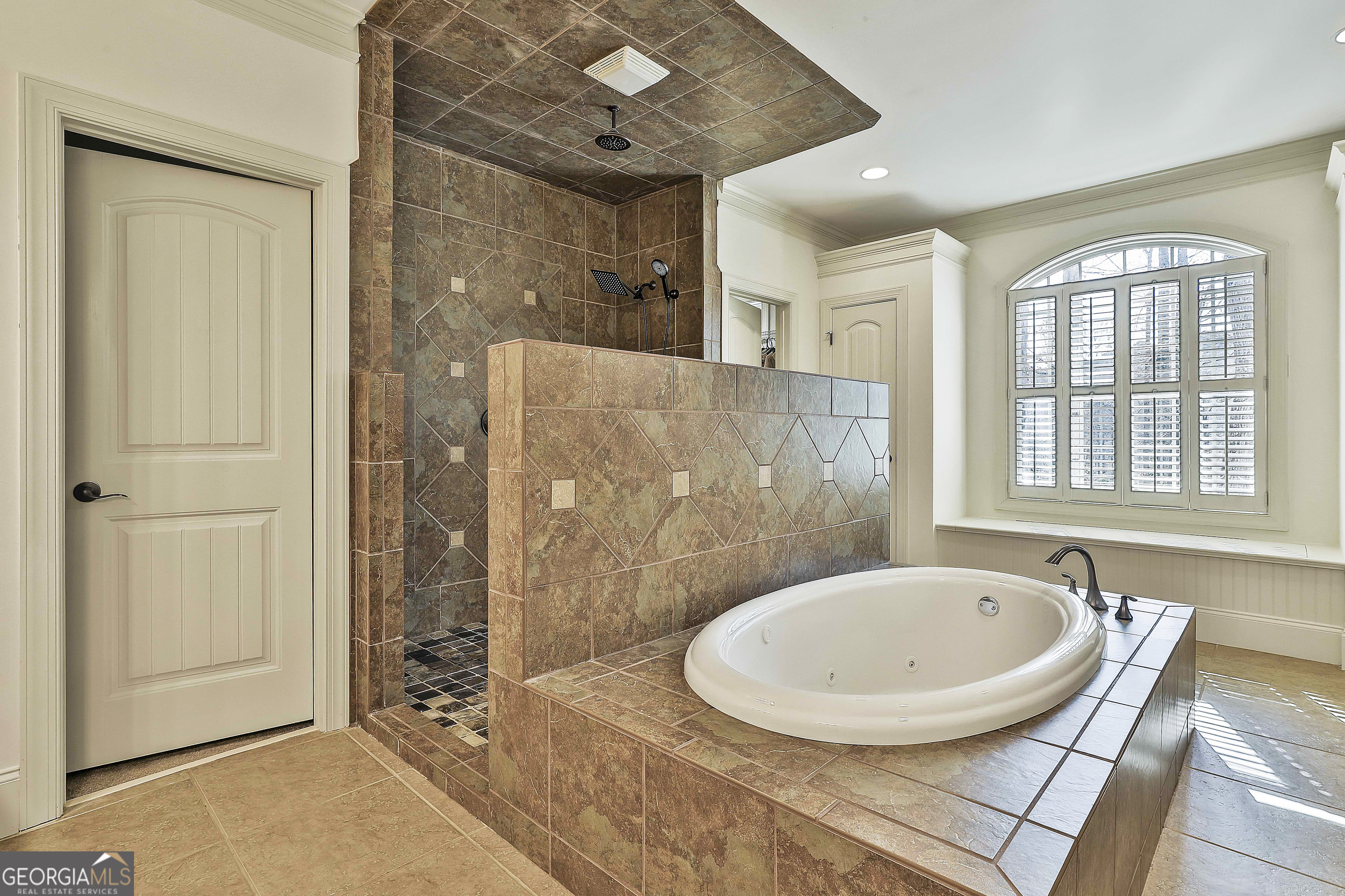 35 Fern Leaf Way Newnan, GA 30265 - Photo 56 of 112 a bathroom with a sink a mirror a bathtub and shower