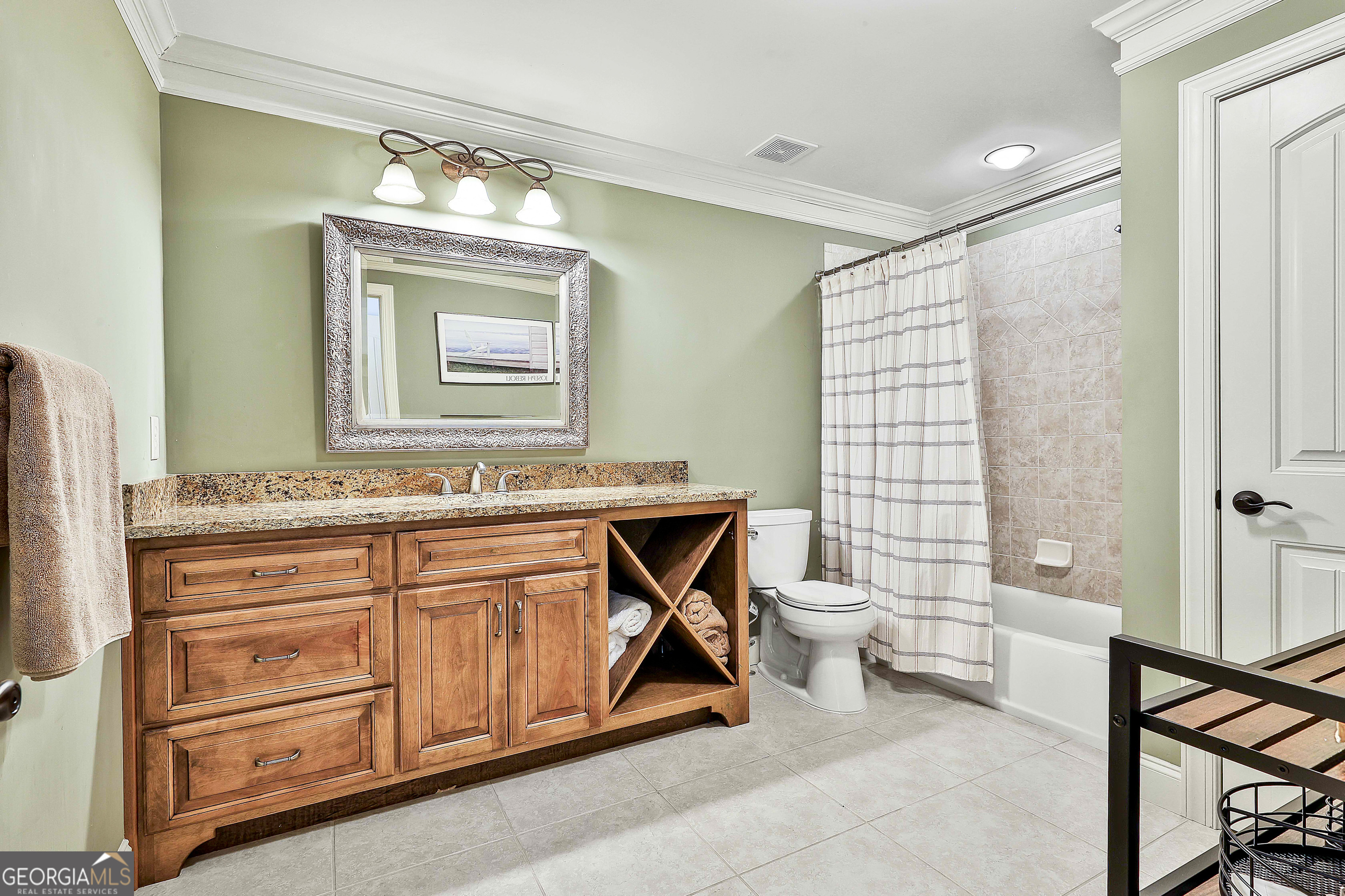 35 Fern Leaf Way Newnan, GA 30265 - Photo 63 of 112 a bathroom with a double vanity sink a toilet and a mirror