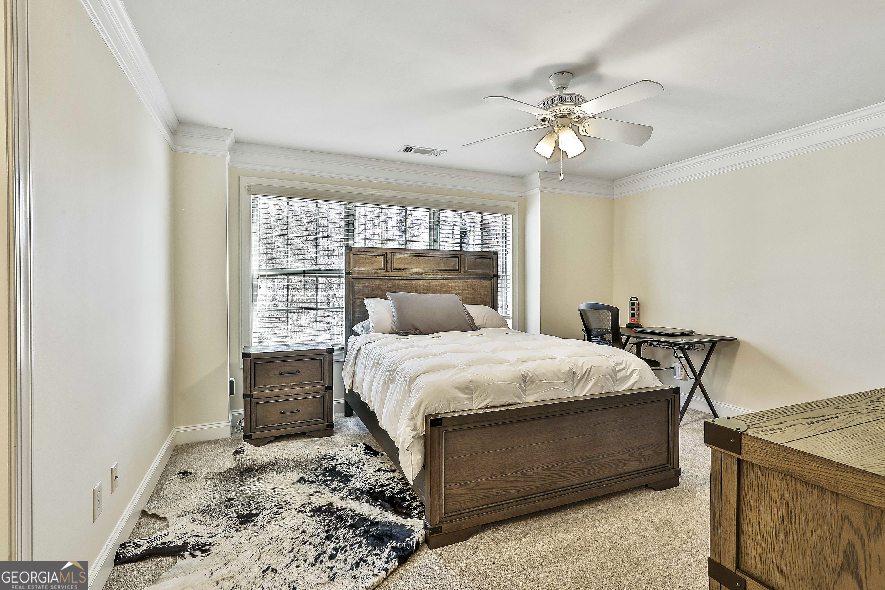 35 Fern Leaf Way Newnan, GA 30265 - Photo 64 of 112 a bedroom with a bed and a chandelier