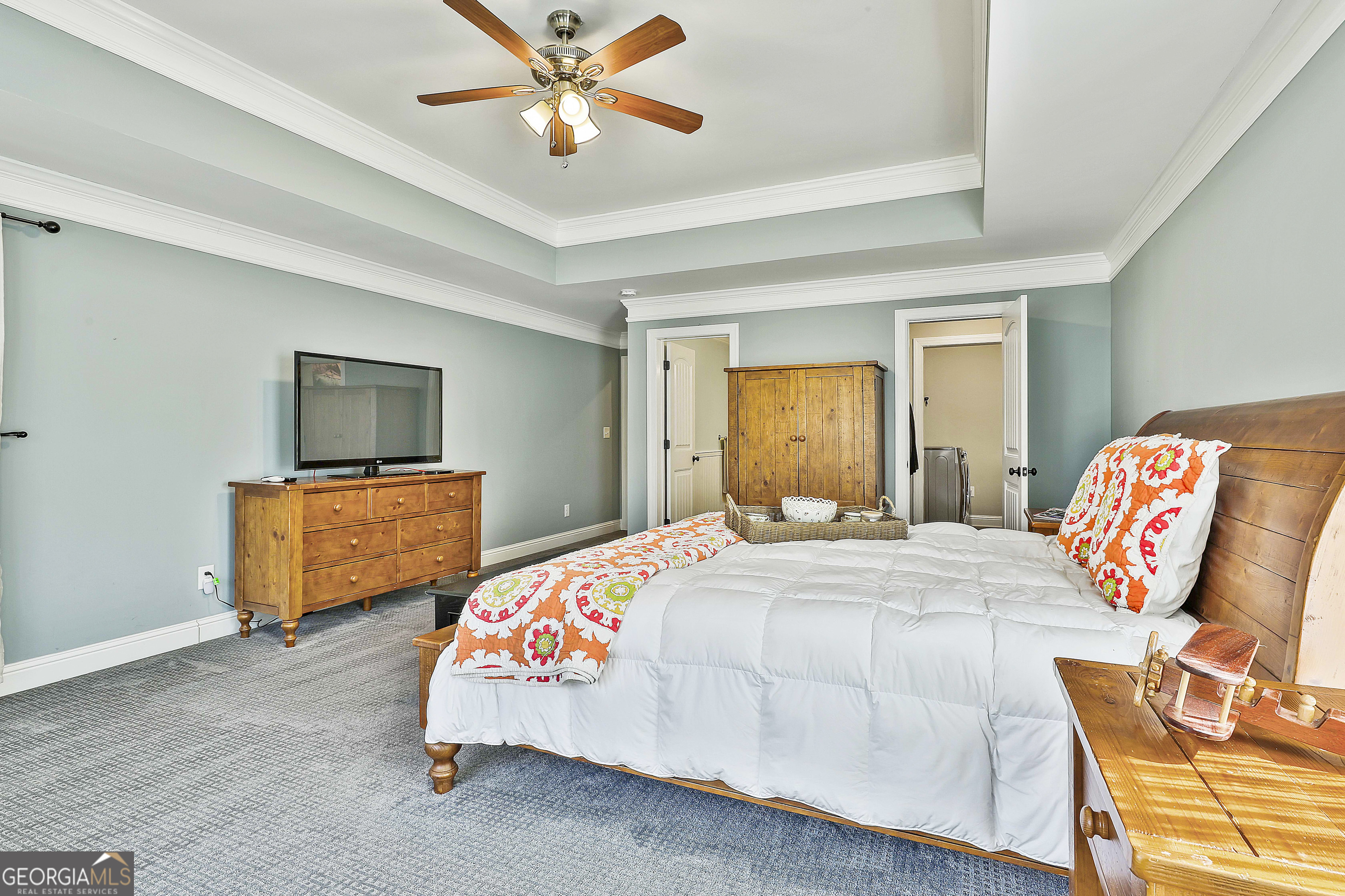 35 Fern Leaf Way Newnan, GA 30265 - Photo 94 of 112 a bedroom with a bed and flat screen tv