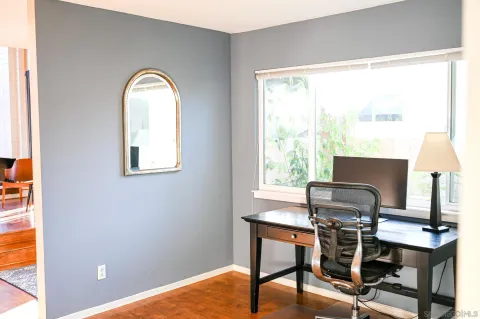 a workspace with furniture and a window
