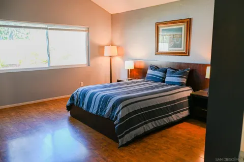 a bedroom with a bed and closet