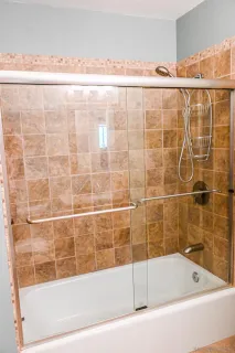 a bathroom with a bathtub and shower